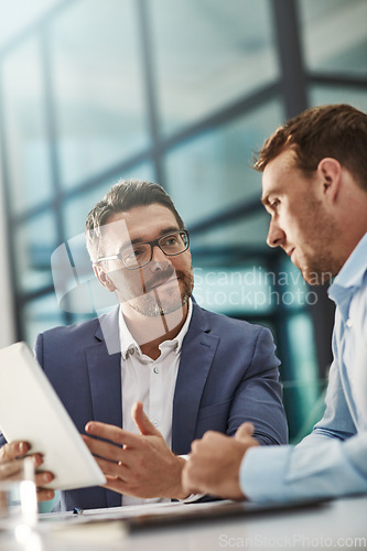 Image of Coaching, training and business people with tablet in office workplace. Collaboration, mentor and men or employees with technology planning sales, marketing or advertising strategy in company meeting