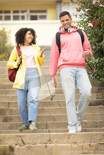 Image of Walking, students and couple of friends talking on stairs ready for college school education. Learning, student communication and freedom of university graduate woman and man with happiness and smile