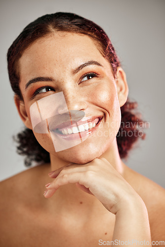 Image of Skincare, health and woman with makeup in studio with a cosmetic, beauty or natural face routine. Happy, smile and female model with wellness or self care facial treatment isolated by gray background