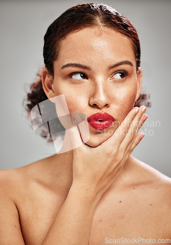 Image of Beauty, face and woman lips with lipstick and makeup, skin and natural cosmetics with red isolated on studio background. Kiss, pout and hand with manicure, spa treatment and glow with cosmetic care