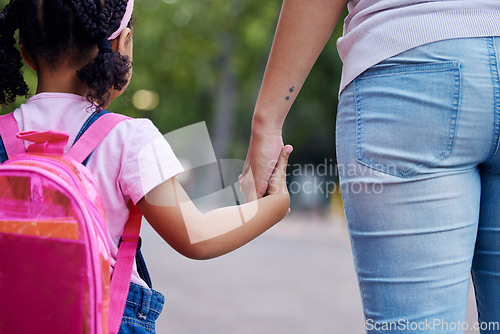 Image of Holding hands, mother and child walking to school, help and care with support outdoor, education for knowledge and growth. Development in childhood, backpack and family, woman with girl and back view