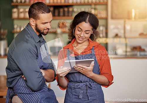 Image of Restaurant, cafe teamwork and couple with tablet to manage orders, inventory and stock check. Diversity, waiter technology and man and woman with digital touchscreen for managing sales in coffee shop