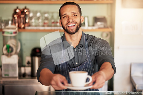 Image of Coffee, cafe and portrait of barista with cup in small business. Restaurant, cappuccino and waiter, man and hands of server holding fresh and delicious mug of caffeine or espresso in shop or store.