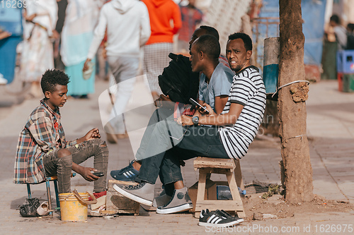 Image of shoe cleaner on the street of Aksum, Ethiopia