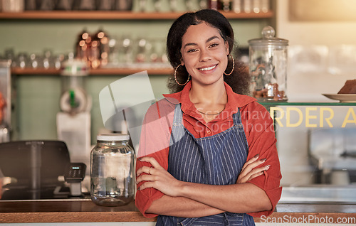 Image of Portrait, cafe waiter and woman with arms crossed ready to take your order. Coffee shop, barista and confident, happy and proud young female employee from Brazil or small business owner of cafeteria.