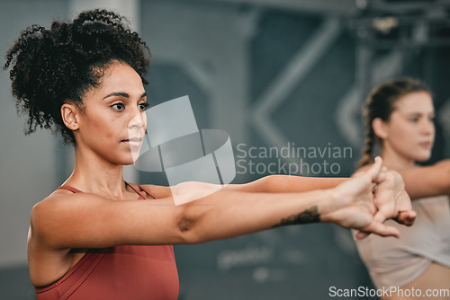 Image of Fitness, stretching and friends with women in gym for training, workout and exercise. Teamwork, health and personal trainer with girl and muscle warm up for wellness, sports and progress goals