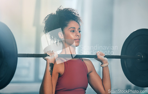 Image of Gym, barbell workout and black woman doing muscle fitness performance, strength training or bodybuilding. Strong exercise girl, body health or bodybuilder weightlifting for athlete wellness lifestyle