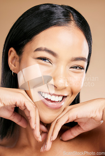 Image of Beauty, makeup and portrait of a woman with foundation for skincare isolated on a studio background. Laughing, happiness and face of a cosmetics latino model smiling for glow on skin on a backdrop