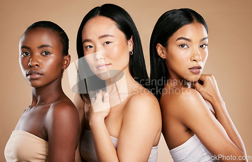 Image of Skincare, diversity, and portrait of multicultural models with salon hair on studio background. Health, wellness and luxury cosmetics, healthy skin care and beautiful people, women in natural makeup