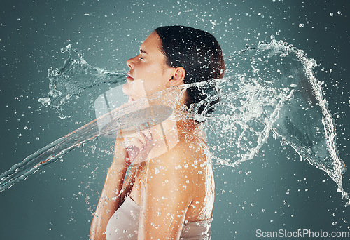 Image of Water drop, beauty and skincare routine for woman washing skin or body for hygiene isolated in a studio background. Self care, grooming and female dermatology for young beautiful adult