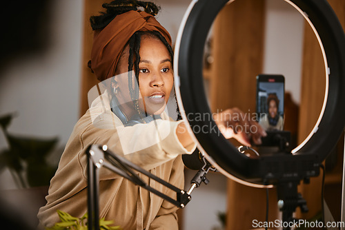 Image of Communication, phone and influencer broadcast podcast, radio talk show or speaker talking about teen culture. Presenter microphone, black woman setup streaming or speaking about online student news