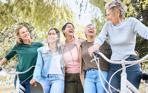 Image of Happy senior woman, friends and laughing in joyful happiness enjoying fun time together at the park. Group of elderly women bonding and sharing joke, laugh or walking and cycling in the outdoors