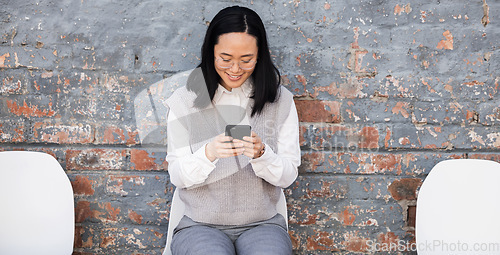 Image of Woman texting, waiting for interview on chairs and typing on phone, recruitment and employment with smile. Happy person in Japan sitting on chair, smiling and excited for job opportunity for people.