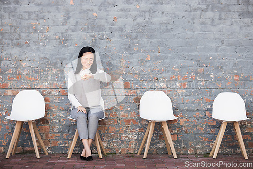 Image of Business, Asian woman and check time for job interview, waiting and smile in line on chair. Female employee, confident lady and interviewee for work opportunity, hiring and schedule with appointment