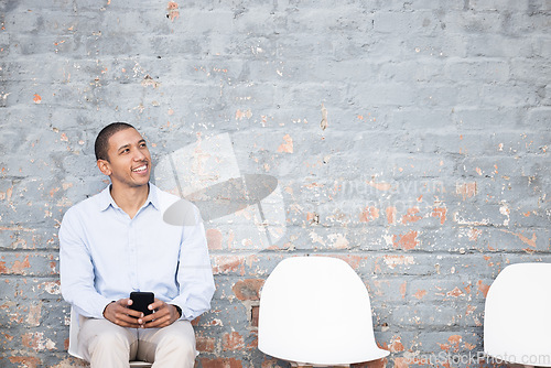 Image of Recruitment, thinking and black man on brick wall or waiting room with career dream, opportunity or job search. Happy person sitting in line with smartphone for hiring news, interview and cv ideas