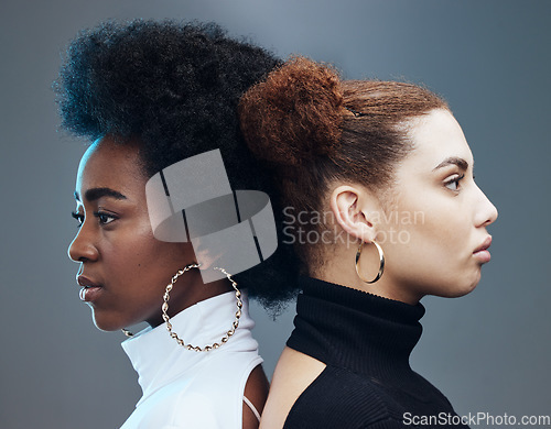 Image of Fashion, hair care and women with futuristic diversity, cyberpunk aesthetic and isolated on a studio background. Future, creative and models modeling for a designer brand with a vision on a backdrop