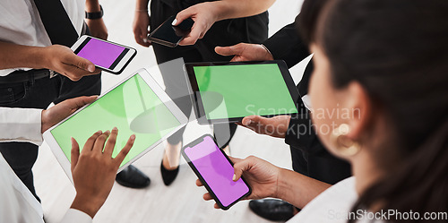 Image of Hands, green screen and technology with a business group in studio isolated on a white background for communication or networking. Tablet, phone and mockup with an employee team on blank space