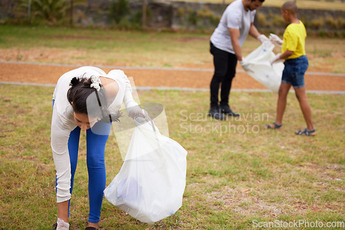 Image of Community volunteer, garbage and people cleaning trash, pollution or waste product for environment support. Plastic recycling, NGO charity and eco friendly person helping with nature park clean up