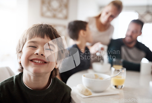 Image of Happy, breakfast and portrait of boy with family for at kitchen table for food, child development and bonding. Quality time, smile and happiness with son at home for diet, morning and nutrition