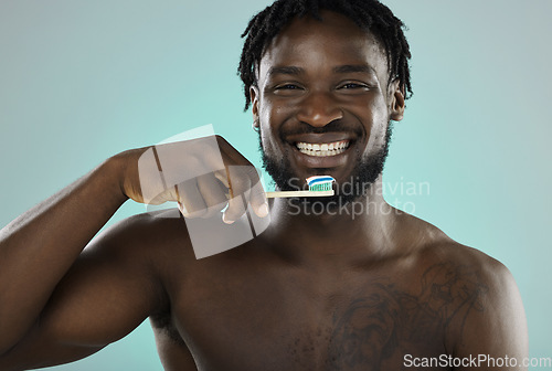 Image of Black man, face and toothbrush with smile in portrait, teeth whitening and cleaning mouth isolated on studio background. Fresh breath, beauty and hygiene with toothpaste, health and dental wellness