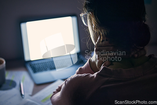 Image of Mockup, screen and student tired at night, focus and notes for test, studying and education. Woman, female and academic with laptop light, pain in neck and revision in the evening, dark and computer