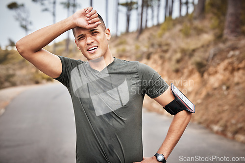 Image of Tired, fitness and running man portrait of a marathon runner on a road feeling fatigue from workout. Exercise, athlete and sports person breathing from a health, wellness and cardio training