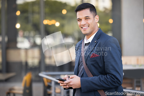 Image of Phone, portrait and happy businessman in the city with success, leadership and confidence. Technology, mobile and professional corporate manager with a smile networking on a cellphone in the town.