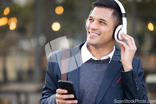 Image of Headphones, business man and outdoor phone listening with music streaming ready for work. Radio, mobile 5g connection and young professional with web podcast on technology and internet with bokeh