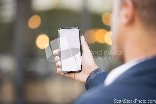 Image of Businessman, hand and mockup phone in city for schedule planning app, email communication or networking. Man, smartphone mockup space and reading screen for calendar, web article and financial news
