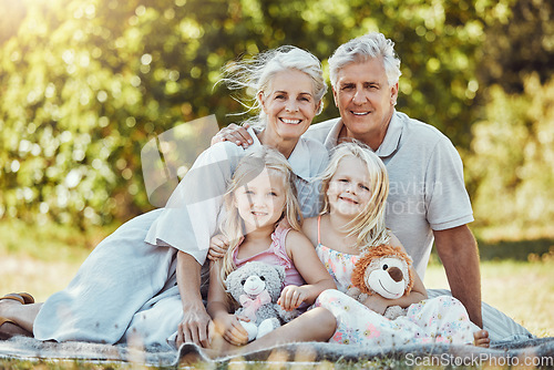 Image of Grandparents, girl children and family portrait in a outdoor park happy about a picnic. Smile, happiness and kids with elderly grandparent in a garden or backyard smiling from bonding together