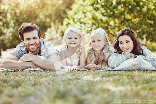 Image of Family, park and portrait of parents and children outdoor on garden grass with love and smile. Happy, nature and kids with mom and dad together on vacation with parent care and fun relax on a picnic