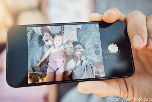 Image of Phone, selfie and family portrait of a hand with mobile zoom and smile with happiness. Children, parents and happy together with love and care using a cellphone with a mom and kids on holiday