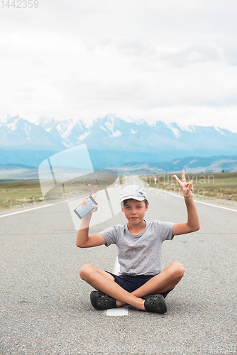 Image of Woman sitting on the road