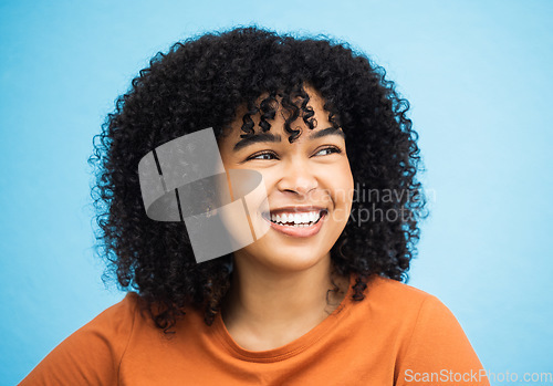 Image of Black woman, happy and thinking face in blue background studio for empowerment support, positive mindset and confident. Young african girl, smile and happiness vision, ideas or thoughtful looking