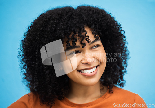 Image of Happy, black woman or afro hairstyle on isolated blue background with keratin treatment, self love or healthcare wellness. Headshot, smile or beauty model with curly brunette trend on urban city wall