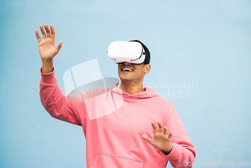 Image of Vr, headset or metaverse fun on isolated blue background for ai esports, gaming cyber world or futuristic fantasy game. Smile, happy man or virtual reality with hands touching in digital software ar