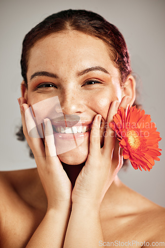 Image of Happy portrait, beauty face and flower for skincare woman with dermatology and cosmetic. Floral facial, wellness and self care for freckles skin glow, healthy teeth and natural makeup model in studio