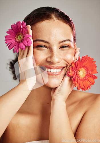 Image of Skincare, daisy flower and beauty portrait of a woman for dermatology, makeup and cosmetics. Facial, wellness and self care for skin glow, floral product and happy face of a natural model in studio