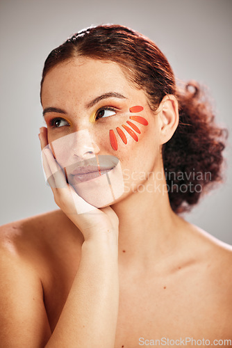 Image of Flower face, skincare and natural beauty of a woman for dermatology, makeup and cosmetics. Facial, wellness and self care for skin glow, floral idea and a healthy model thinking creative in studio