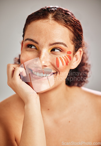 Image of Woman face, makeup and flower for natural beauty skin glow, cosmetics and dermatology. Spa facial, health and wellness of happy aesthetic model person thinking floral product idea in studio