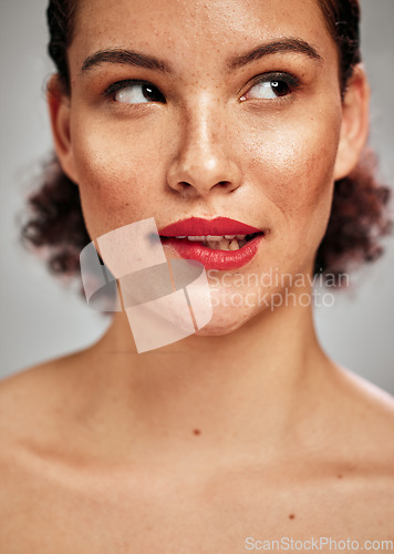 Image of Beauty, face and woman with lipstick, thinking with makeup and flirt, sexy with skin and cosmetics isolated on studio background. Skincare, bite lips and red with spa treatment and cosmetic care