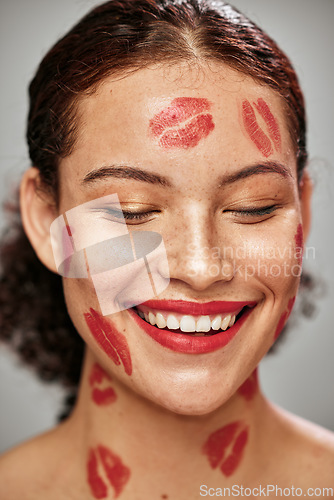 Image of Happy woman, lipstick kiss and red color makeup on face of model in studio for cosmetics. Headshot of aesthetic person thinking about love for valentines day spa facial idea or skincare motivation