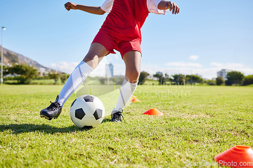 Image of Soccer kid, field and training for sport fitness, balance and control with speed, body health and development. Cropped football player child, fast dribbling and exercise feet on pitch with commitment