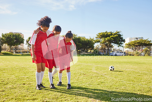 Image of Children, soccer and girl team help, support and walking with injured friend at soccer field. Sports injury, kids and football player group helping, holding and carrying player for football accident