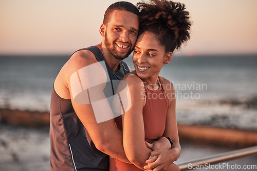 Image of black couple, hug and relax beach fitness together for cardio workout, exercise training and freedom outdoor. Black man, woman smile and happy hugging by ocean sea for bonding or runner wellness rest