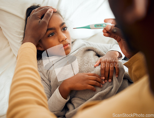 Image of Sick, girl and dad checking thermometer of ill kid or daughter lying on a bed feeling sad. Concern, care and parent in bedroom with worried child with flu, cold or fever giving her support