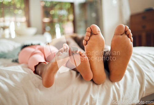 Image of Family, bed and feet of father and girl enjoying quality time, holiday and freedom on weekend together. Love, home lifestyle and dad with child in bedroom to relax, bonding and happiness in morning