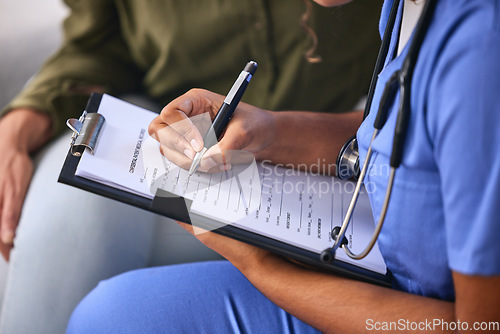Image of Hands, writing and healthcare with a nurse and patient in consultation for insurance or medicine in a home. Medical, documents and clipbpard with a medicine professional and female client in a clinic