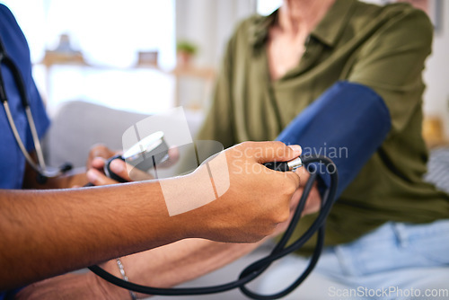 Image of Blood pressure, hospital and hypertension health test of doctor hand consulting a woman. Nurse, consultant and health care worker for life insurance checking cardiovascular results with monitor