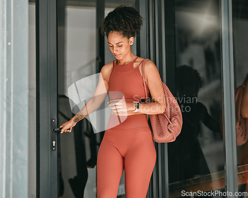 Image of Ready, welcome and door with black woman in gym for workout, exercise and motivation. Training, wellness and sports with girl athlete and bag for cardio, endurance and stamina goal lifestyle